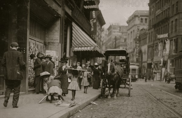 Little Girl Woodpickers Making Up a Load 1910