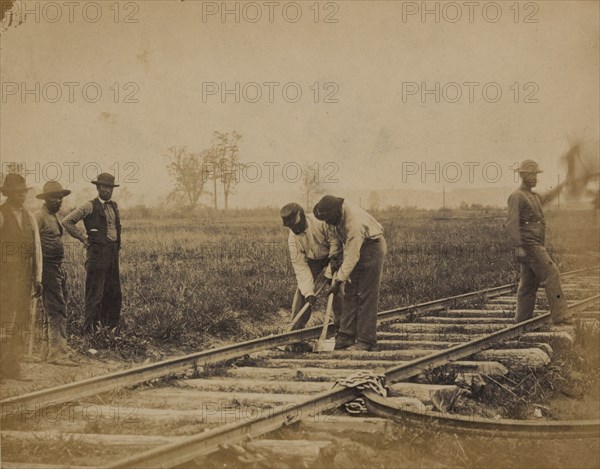 Military railroad operations in northern Virginia: African American laborers working on rail 1863