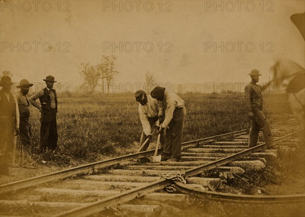 Military railroad operations in northern Virginia: African American laborers working on rail 1863