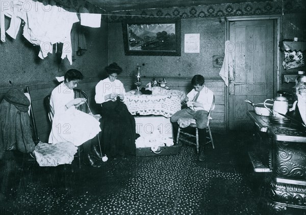 Mother and Aaron, 13 yrs., and Elizabeth 12 yrs old, working on crochet slippers. 3 1912