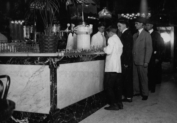 One of the young table boys in Newsome's ice cream parlor. Location: Birmingham, Alabama. 1914