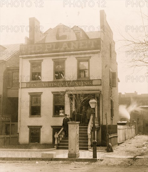 People posed on porch of and in the Planet newspaper publishing house, Richmond, Virginia 1900