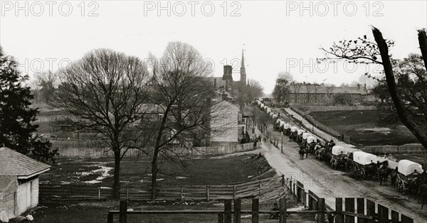 Petersburg, Virginia. The first Federal wagon train entering the town 1865