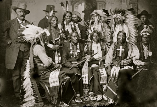 Sioux and Arapahoe Indian Delegations. L to R Seated - Red Cloud, Big Road, Yellow Bear, Young Man Afraid of his Horses, Iron Crow. L to R Standing - Little Bigman, Little Wound, Three Bears, He Dog 1875