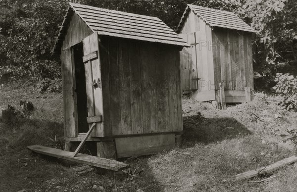 Sunset School - Showing bad location of toilets, - above the school and near together.  1921