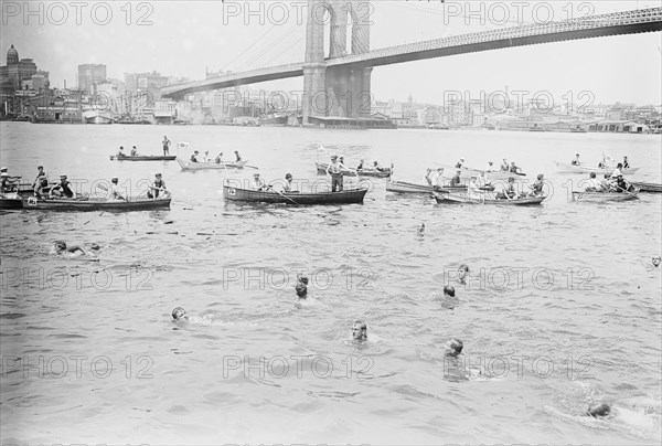 Swimmers Race to Coney Island just past the Brooklyn Bridge