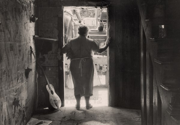 Family moving out of their home which is being taken over by the army 1941