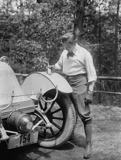 Thomas painting a fender with a brush