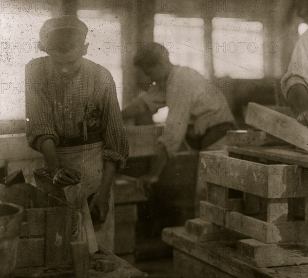 Young boy polishing marble in Vermont Marble Co., 1910