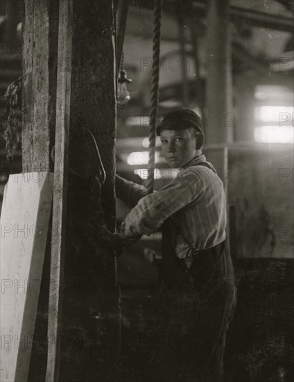 Young boy running machine in Vermont Marble Co., Centre Rutland, VT 1910