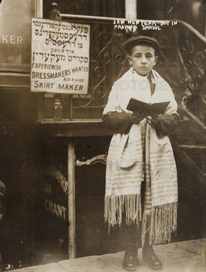 Jewish Boy in Prayer shawl and Sidur celebrates the Hebrew New Year