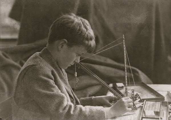 Young Boy with a Mechanical Toy 1924