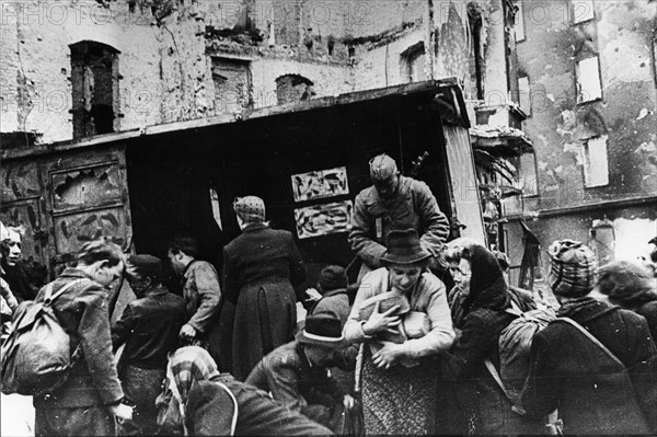 Red army soldiers distributing bread to berlin residents after germany's surrender, world war 2, 1945.