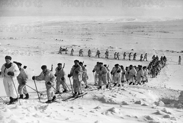 A detachment of soviet navy skiers on maneuvers prior to engaging german positions on the first baltic front.