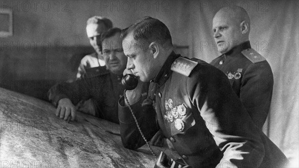 General konstantin rokossovsky, commander of the first byelorussian front, on the phone prior to the battle for stalingrad, on the right is lieutenant general telegin, member of the military council of the front.