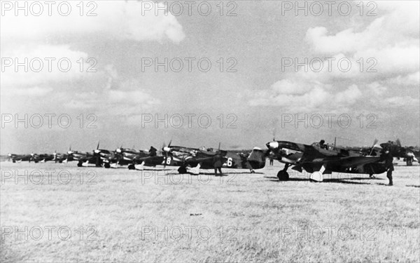 World war 2, soviet air force yakovlev yak-7 fighters lined up on an airfield, these planes were built with funds donated by collective farmers of the bashkir republic.