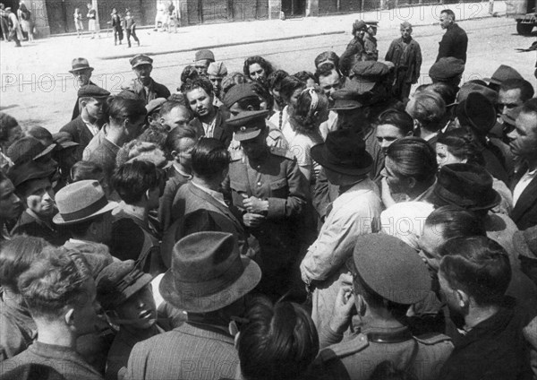 World war 2, a soviet officer surrounded by the inhabitants of liberated lvov, ukraine, 1944.