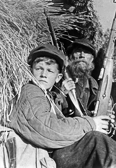 The partisan detachments operating in occupied soviet territory during the war against hitler germany included old men, women and adolescents, all of them were united by their hatred for the fascists who had brought much grief, death and destruction to their land.