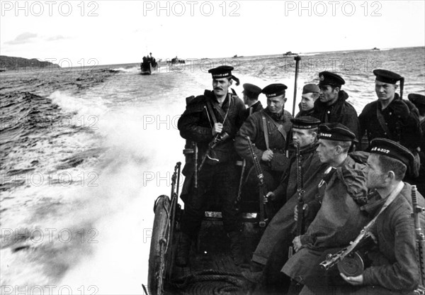 An amphibious marine force is disembarked from the ships of the soviet north fleet in 1942.