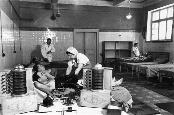 Soviet health spa, the mud baths of a clinic for workers at the central health resort institute, june 1952.