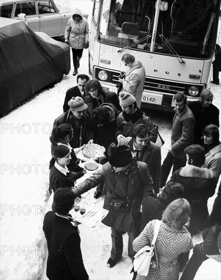 Foreign tourists being greeted in front of the hotel malyovitsa in the rhodope mountains, bulgaria, 1977.