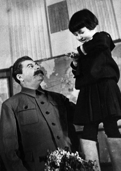 Joseph stalin receiving a bouquet of flowers from engelsina (gelya) markizova, the 7-year-old daughter of the second secretary of the buryat-mongolian regional party committee in 1936, stalin had him executed the following year, her mother was arrested and exiled to kazakhstan where she died under suspicious circumstances in 1940.
