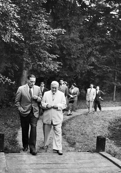 Bulganin's picnic party for foreign diplomats and journalists visiting moscow, us ambassador charles bohlen having a friendly chat with the chairman of the council of ministers of the ussr, n,a, bulganin while walking in the garden, moscow, august 1955.