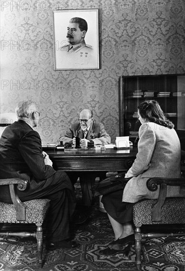 August kirchenstein, chairman of the presidium of the supreme soviet of the latvian ssr receiving visitors on the occasion of the 10th anniversary of soviet latvia, june 1950.