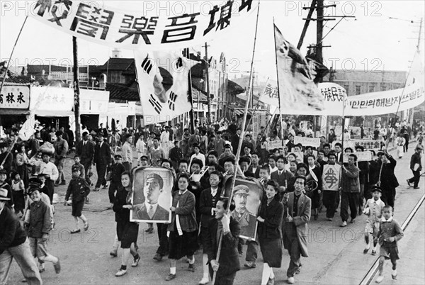 A demonstration in pyongyang, north korea held on the day when the returns of the elections to the people's committees were published, may 1947.