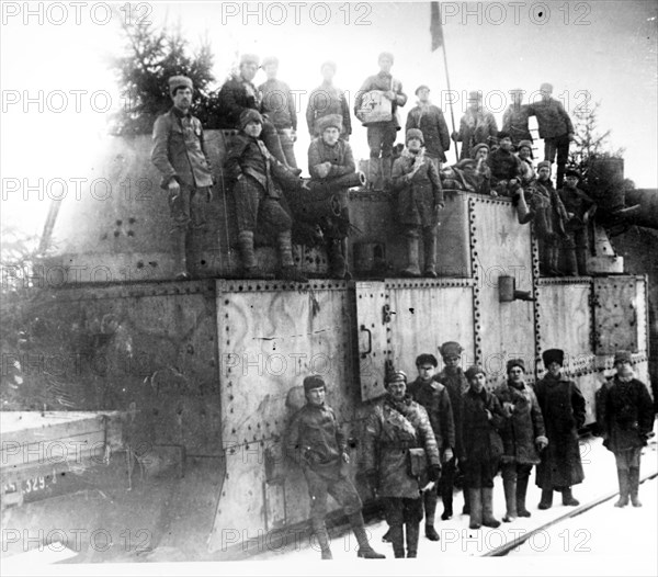 Red army soldiers near an armored train during the kronshtadt revolt in 1921.