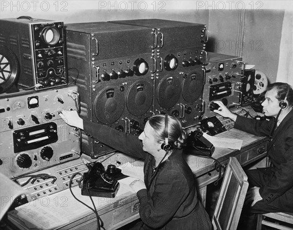 The frequency of the radio signals from sputnik 1 being measured at a radio control post near moscow observatory, 1957.