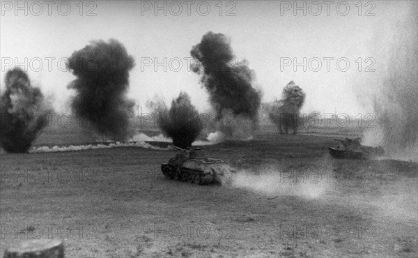 World war 2, 2nd ukrainian front, soviet t-34 tanks attacking german defenses on the right bank of the danube river on the approaches to budapest, hungary, december 1944.