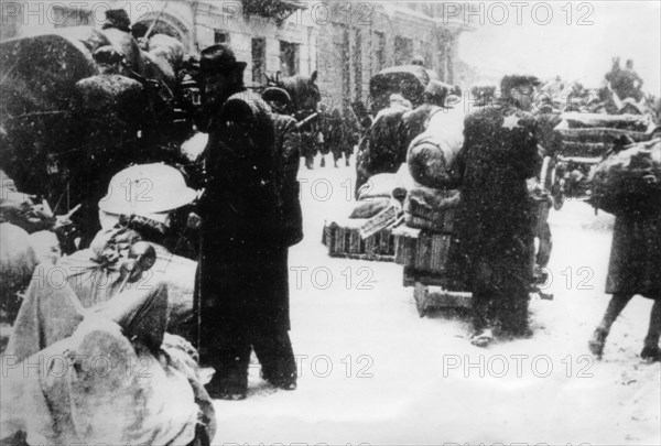 World war 2, jewish citizens of lodz prepare for the forced re-settlement to the city's ghetto, march 1940.