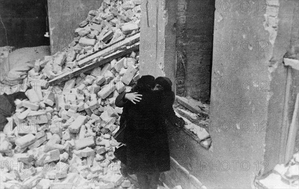 world war ll, residents returning to their home in warsaw, poland at the end of the war and finding it demolished by the germans, february, 1945.