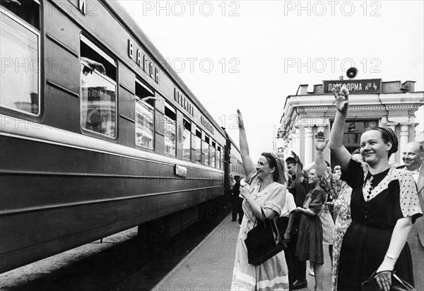 A moscow-tbilisi train pulling out of the kursk railway station in moscow, july 1950.