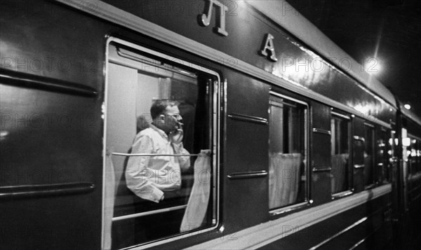 Soviet composer, dmitri shostakovich, on the train on his way home to moscow after the first performance of his 12th symphony 'the year 1917' by the leningrad philharmonic.