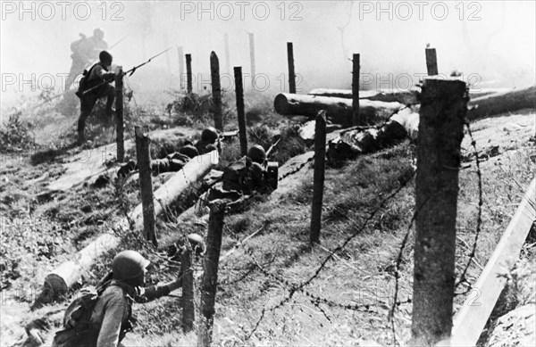 Winter war with finland 1939, soviet red army troops storming a finnish forest stronghold.