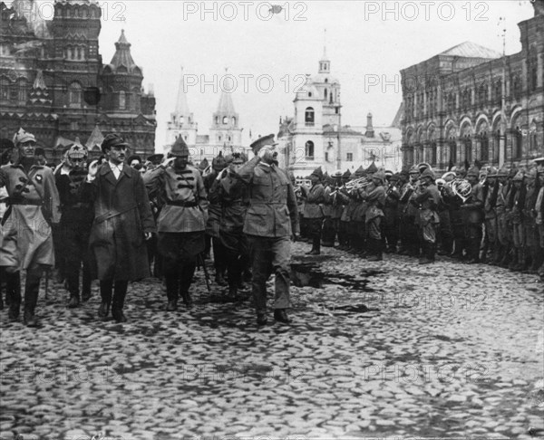 Leon trotsky, people's commissar for military and naval affairs, at a military parade in red square in honor of the third congress of the communist interantion (third international), moscow, soviet union, 1920.