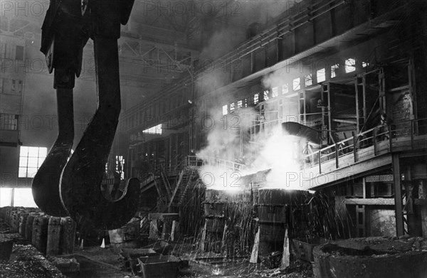 Steel being let out from an open-hearth furnace at the duplex shop of the chussovaya steel works in the molotov region, this is the ural's first duplex shop with bessemer and open-hearth furnaces, february 1947.