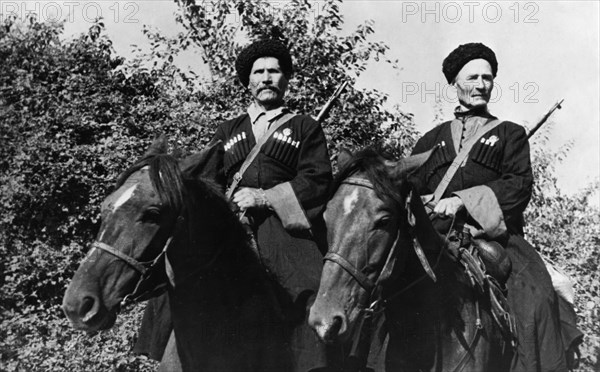 Kuban cossacks, 60 year old pavel kamnev (left) and 63 year old mikhail grachev, who volunteered for service in a cossacks' corps, in one attack, they sabered 28 german officers and men between them, northern caucasus, 1942.