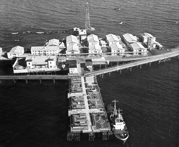 Housing built at neftyanye kamni (oil rocks), an oil workers settlement on the caspian sea in azerbaijan, ussr, february 1969, a park for the workers is in the foreground.