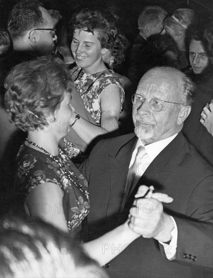 Walter ulbricht, first secretary of the socialist unity party (sed) central committee and gdr state council chairman, dancing with soviet cosmonaut valentina tereshkova during the 'cosmonaut ball' in honor of tereshkova and gagarin, berlin, gdr, october 19, 1963.