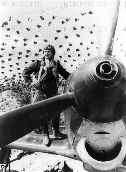 World war 2, soviet air force pilot, kankeshev ahmet haptal from the north caucasus, about to climb into a yakovlev yak-9 fighter, he shot down 6 german planes in 9 days near kuban.