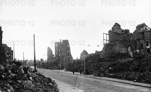 Ernst-thalmann strasse in dresden, germany in 1949 - four years after the city was destroyed by anglo-american bombing at the end of world war 2.