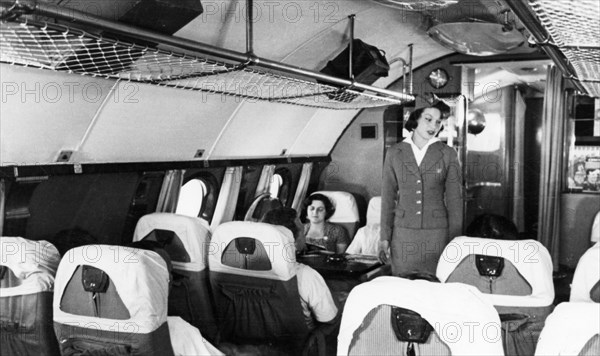 A stewardess and passengers aboard a tu-114 airliner (at the time, the world's largest), 1959.