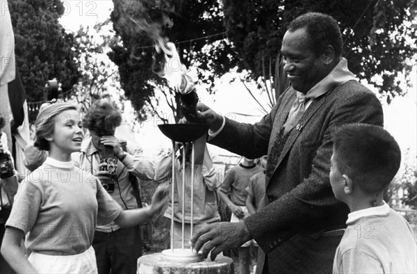 American singer and winner of the international lenin peace prize, paul robeson, lighting the 'fire of friendship' during his visit to the v,i, lenin artek pioneer camp in september 1958.