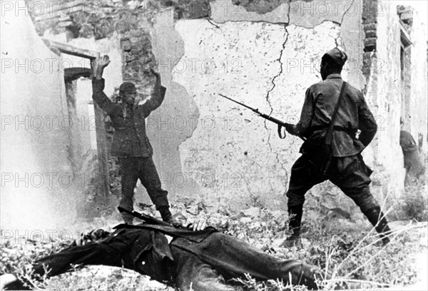 A soviet soldier takes pow a nazi serviceman near the town of mozdok, north ossetia in september 1942.