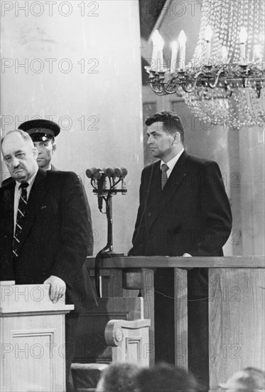 U2 spy plane pilot francis gary powers (right) in the dock at his trial in moscow, august 1960, powers' state appointed defense attorney m,i, grinyev, left.