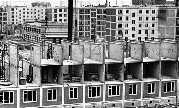 Construction of apartment buildings using pre-fabricated panels in moscow, ussr, 1961.