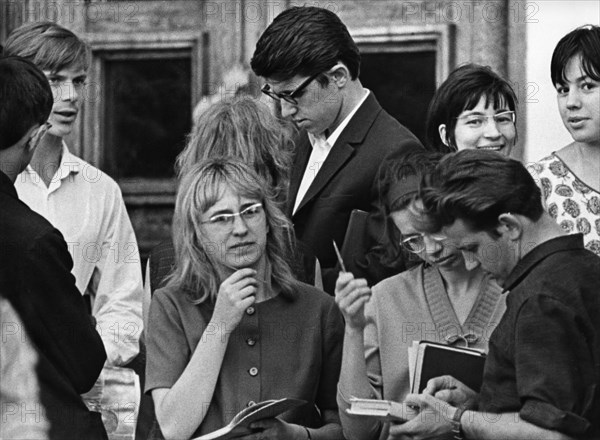 Young russian students outside the exam hall before the moscow state university entrance exams, moscow, ussr, 1968.